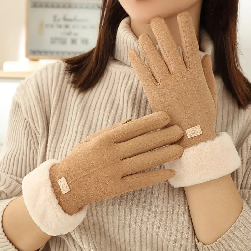 Beige suede women’s thermal touchscreen gloves with plush white fleece cuffs and a small brand tag shown from the back side.