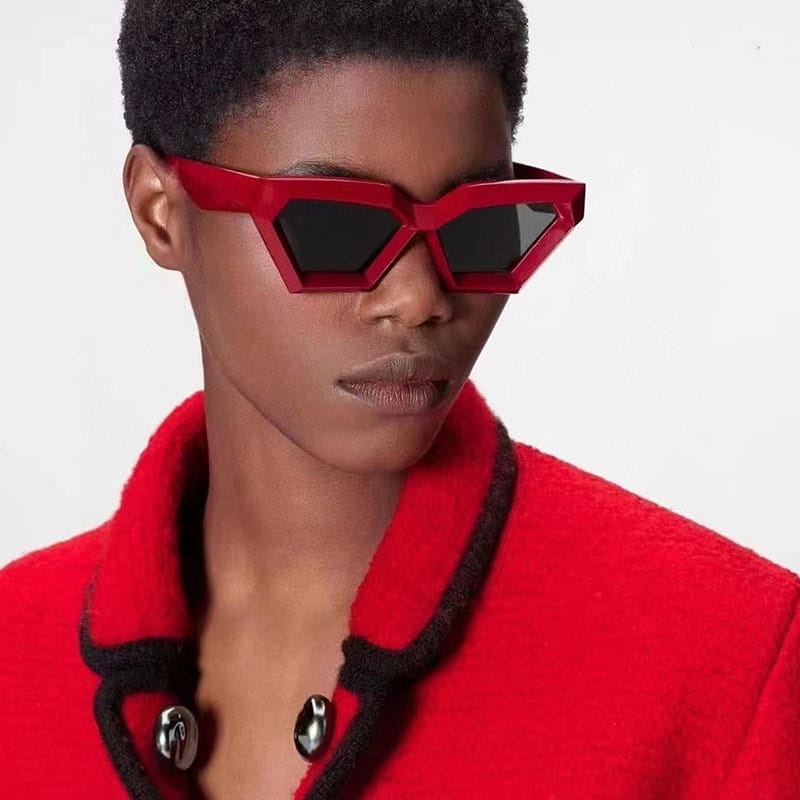 Modern irregular cat eye uv400 geometric sunglasses featuring vibrant red geometric frames and black lenses.