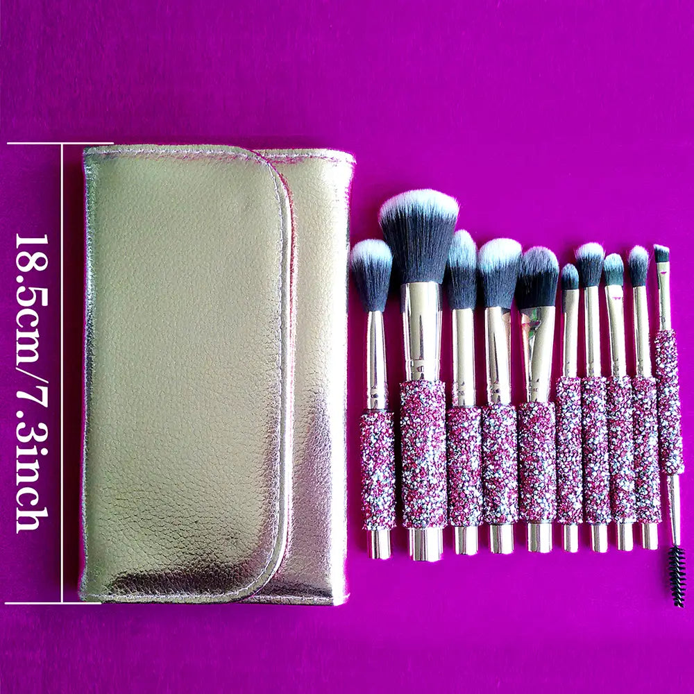 Rhinestone makeup brush set with 10 sparkly pink and silver glitter handles metallic ferrules soft bristles and a matching shiny gold pouch.