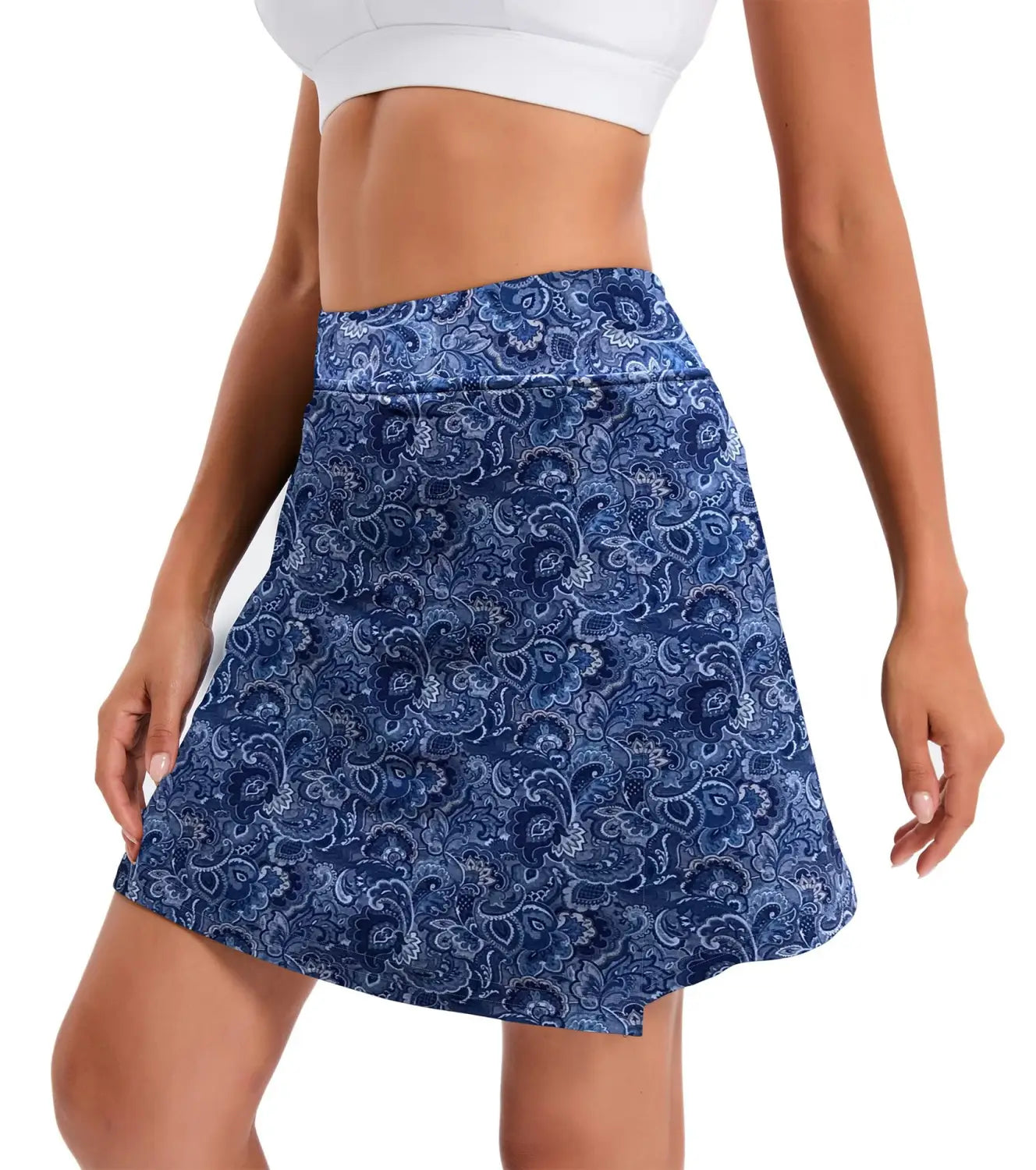 Navy blue high-waisted athletic tennis skirt with an intricate white paisley pattern made from lightweight and stretchy fabric.