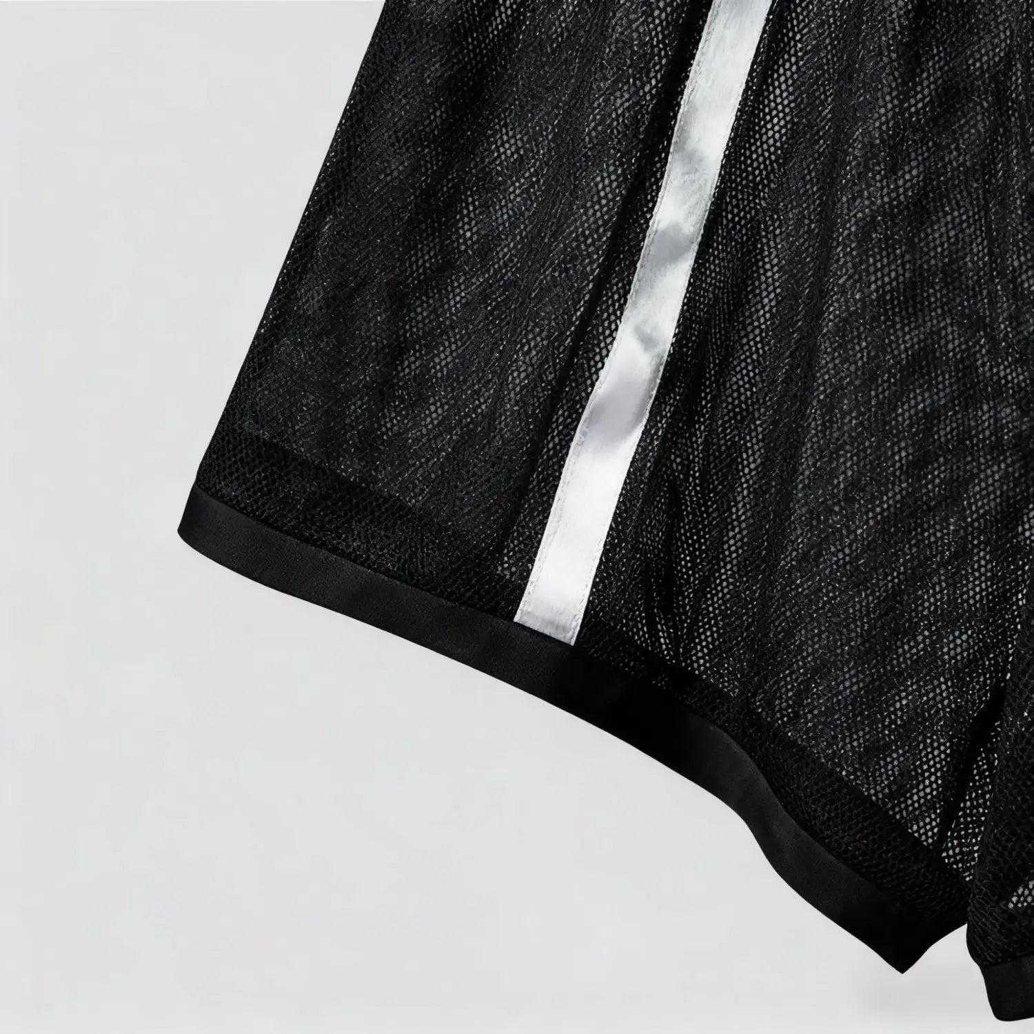 Men quick dry white mesh athletic shorts featuring black mesh fabric with a shiny silver stripe down the center and black satin trim along the hem.