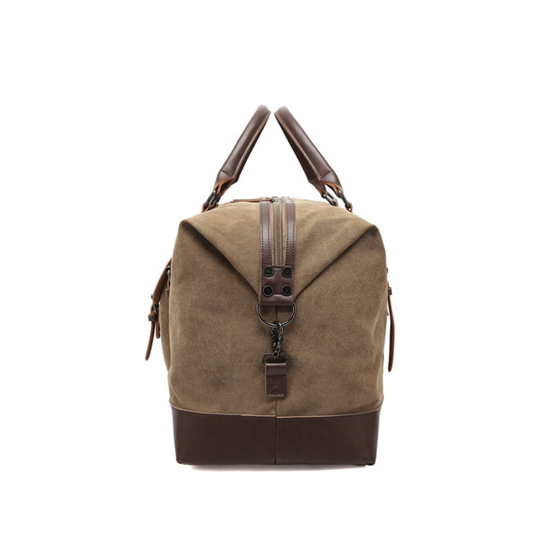 tan canvas duffel bag large travel handbag with brown leather handles and base trim designed for durable and stylish travel use
