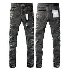 Men’s distressed slim fit patchwork denim jeans in black with visible stitching details and a slim fit design.