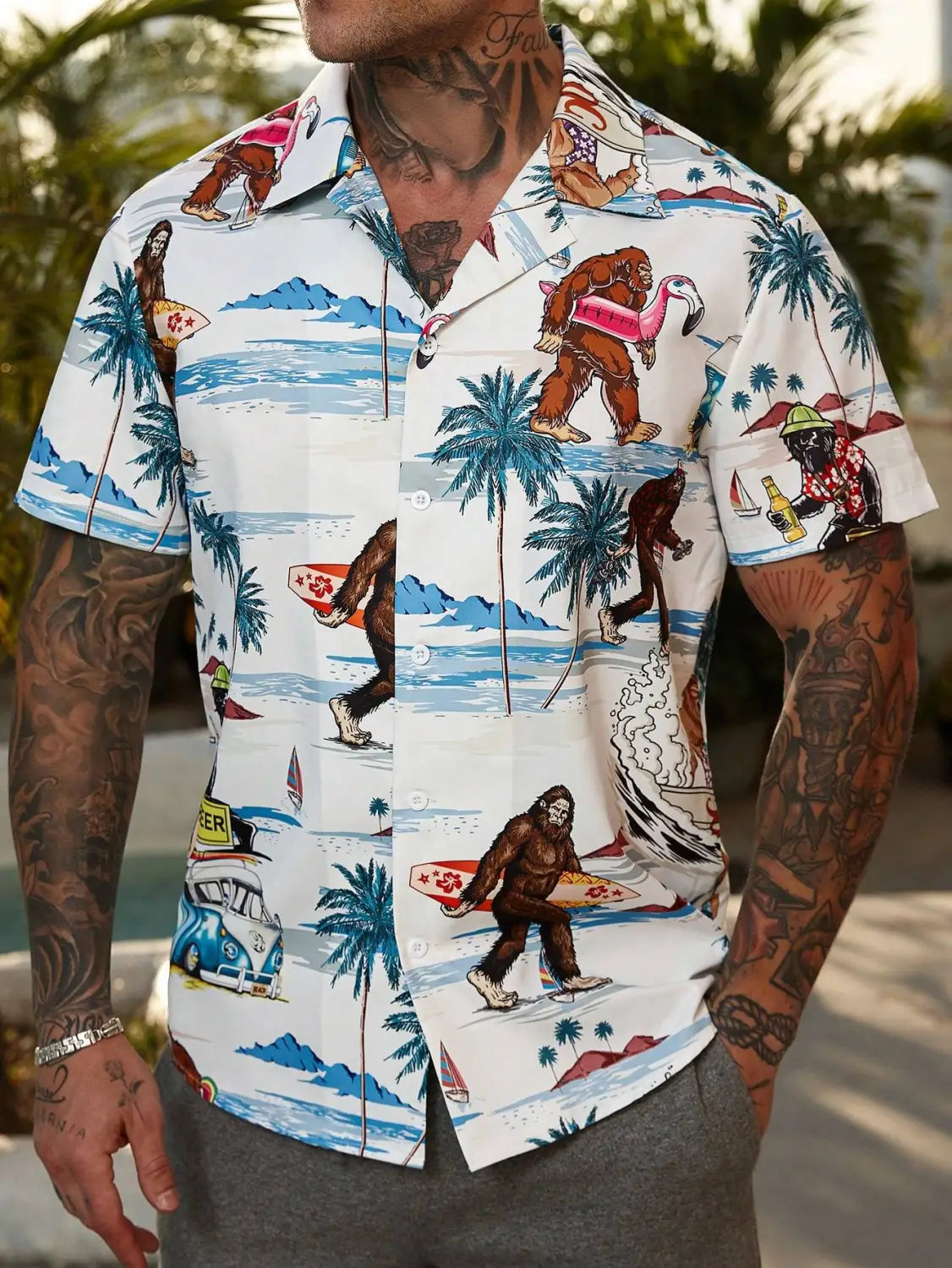 Men’s tropical surfing Bigfoot short sleeve Hawaiian shirt in white featuring a playful pattern of Bigfoot surfing palm trees and vintage beach vehicles in shades of blue red and brown.