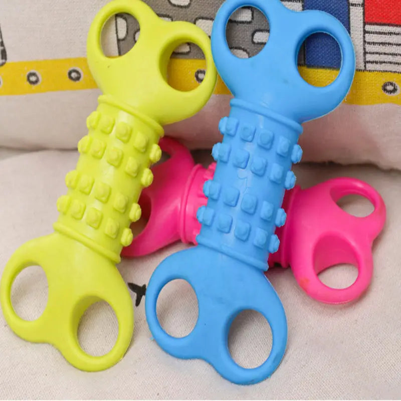 Silicone bone dog chew toy with brightly colored textured plastic handles shaped like keys for teething.