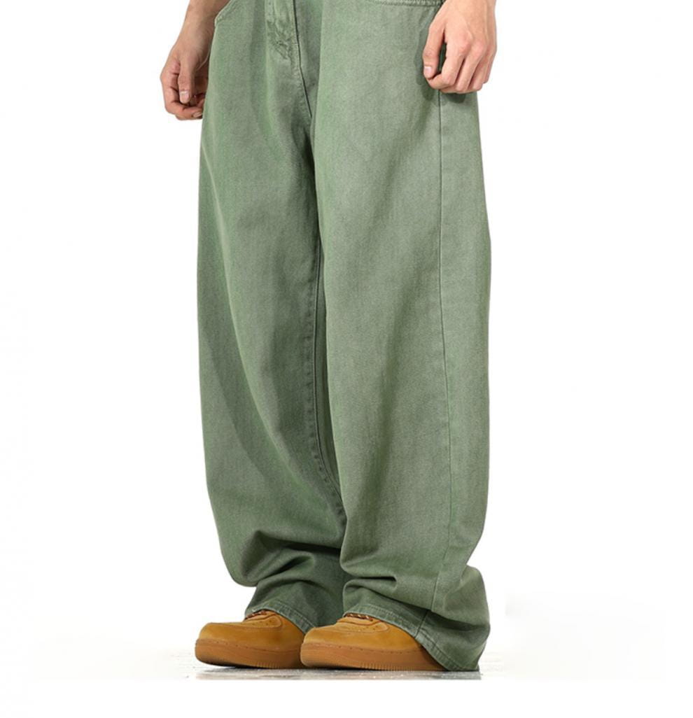 Men’s vintage wide leg high waist relaxed olive green denim jeans with a loose fit.