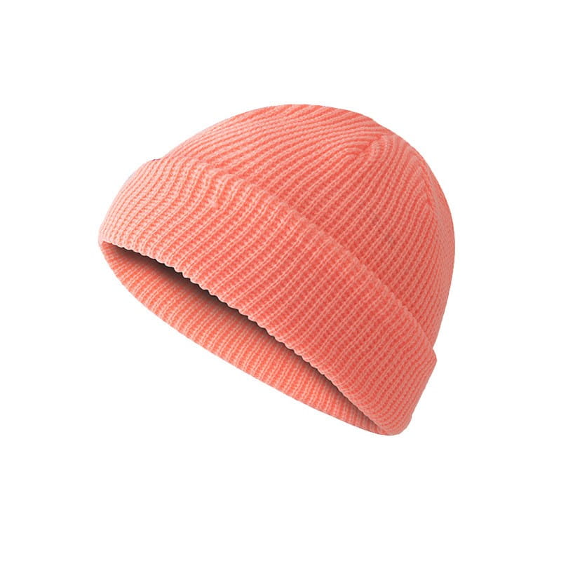 a soft coral-colored ribbed knit beanie with a folded cuff shown instead of the dark gray ribbed wool beanie hat.
