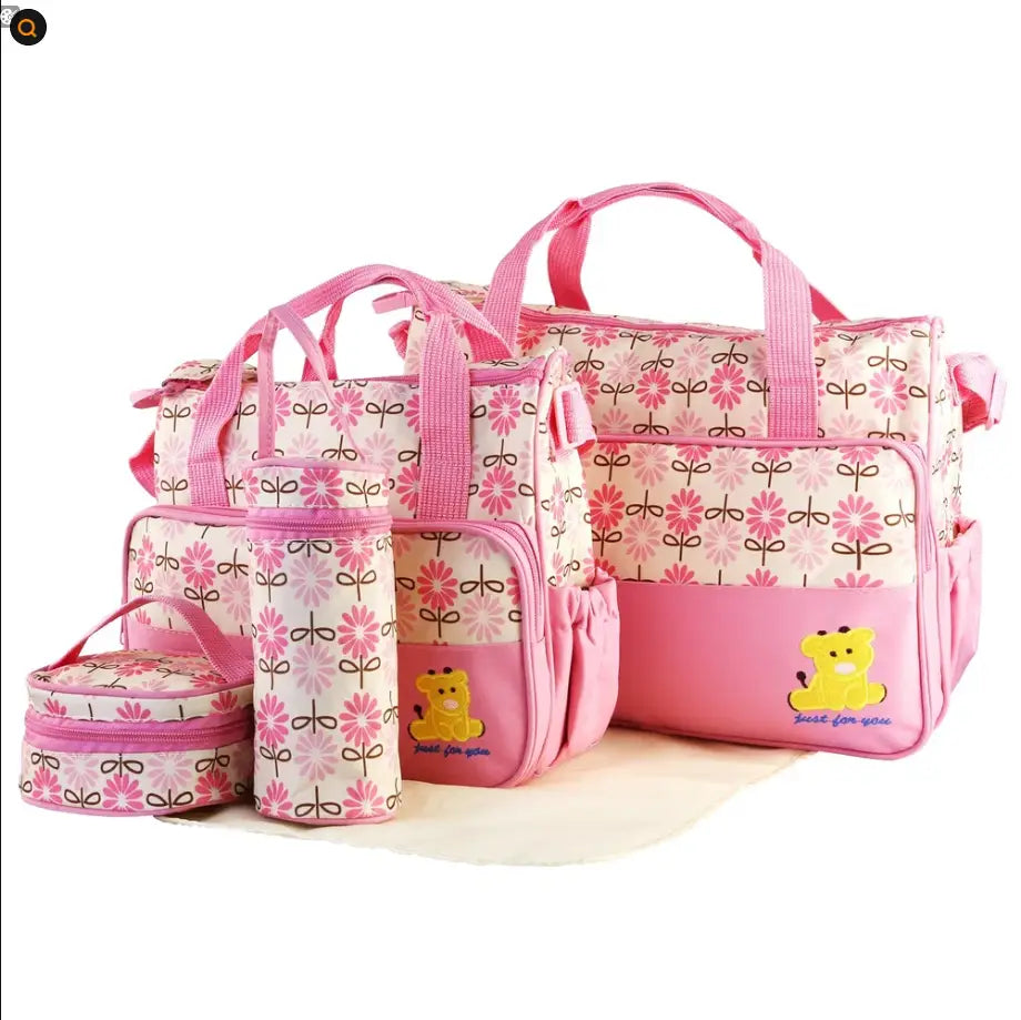 Pink floral-patterned maternity bag set with yellow bear appliqué and matching pink handles from the 5 piece bear appliqué baby diaper travel bag set.