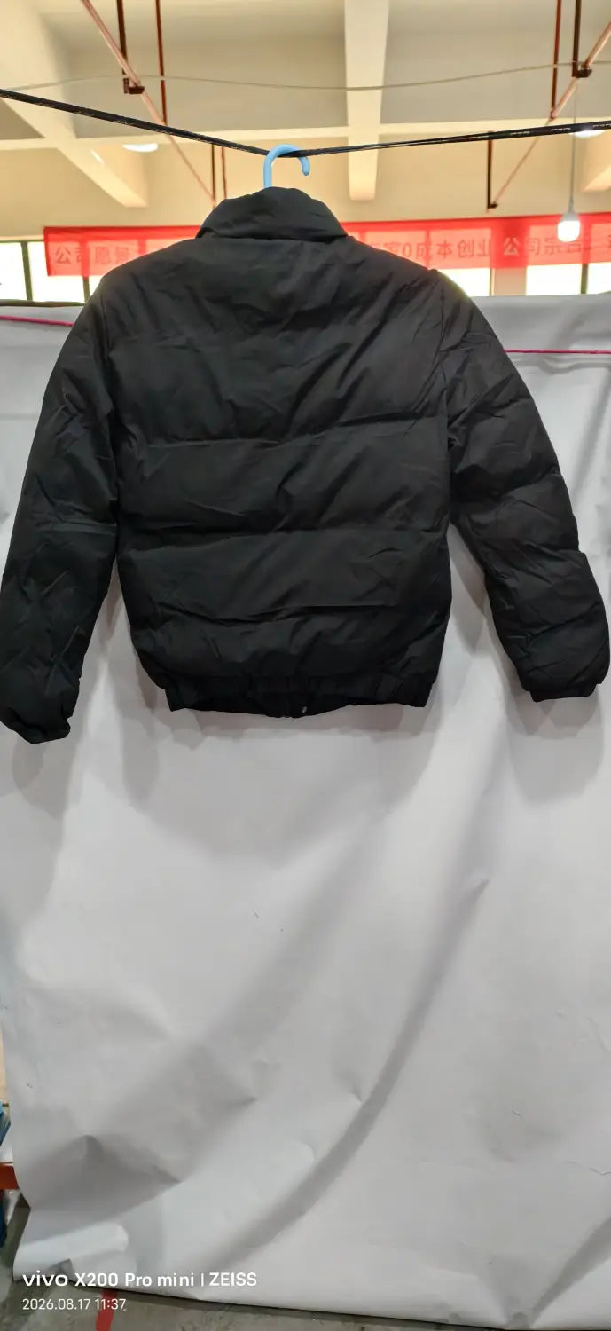 men’s warm padded down jacket in gray featuring a black quilted puffer design with a high collar.