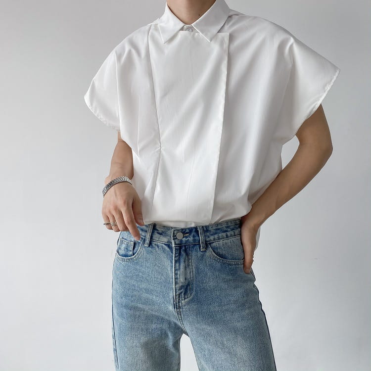 White loose-fitting short-sleeved button-up shirt with classic collar and subtle front pleats designed as a men oversized long sleeve button up shirt alternative.