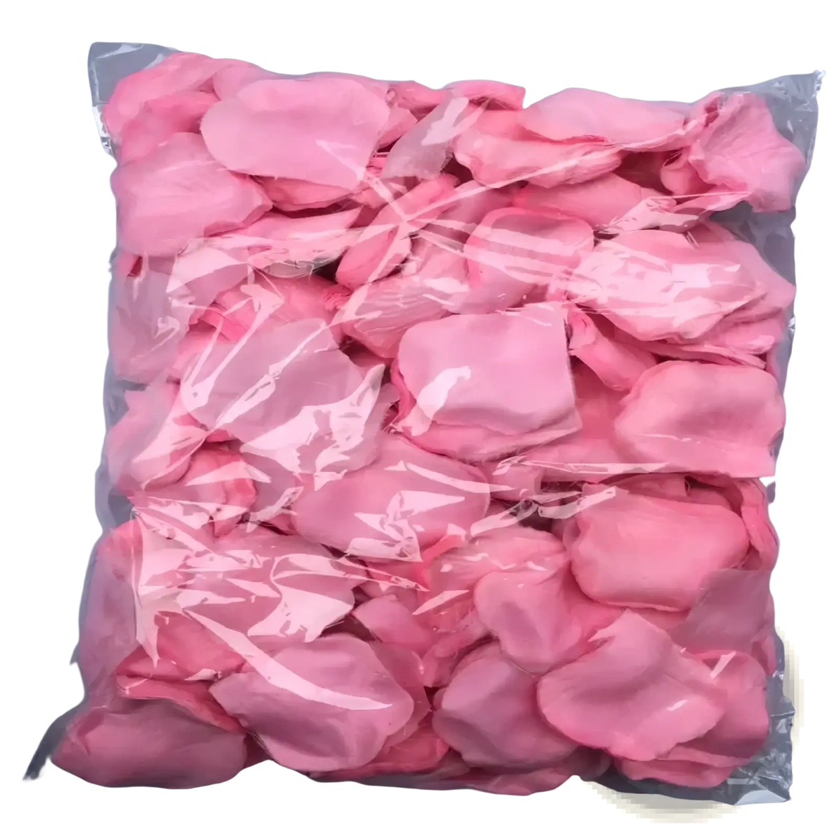A clear plastic bag filled with soft pink artificial rose petals for colorful wedding decor