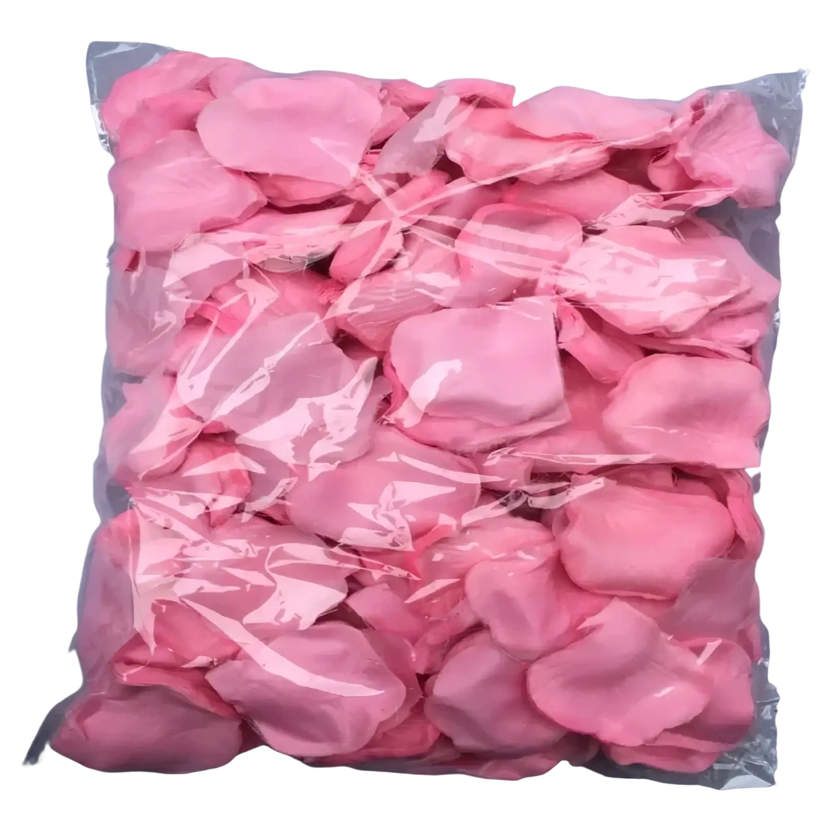 A clear plastic bag filled with soft pink artificial rose petals for colorful wedding decor