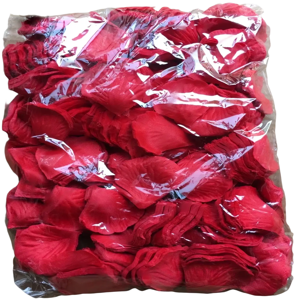 A vibrant red fabric rose petal made from soft textured material packaged in clear plastic for wedding decor