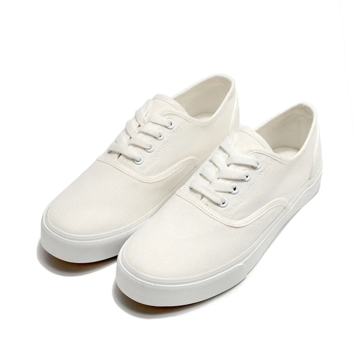 Baskets décontractées basses en toile blanche, à lacets assortis, avec un design propre et minimaliste pour femmes.
