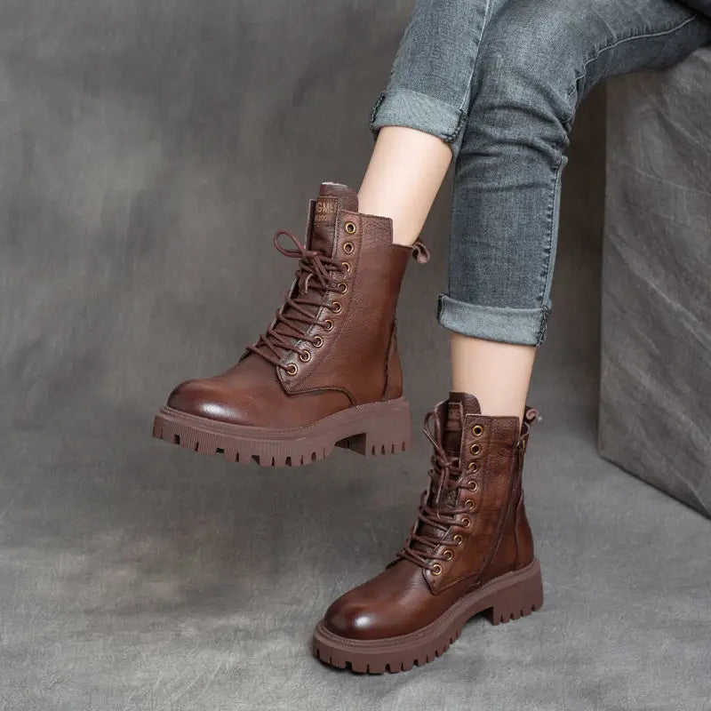 Martin Boots women’s brown leather chunky lace up combat boots with side zipper and thick sole.