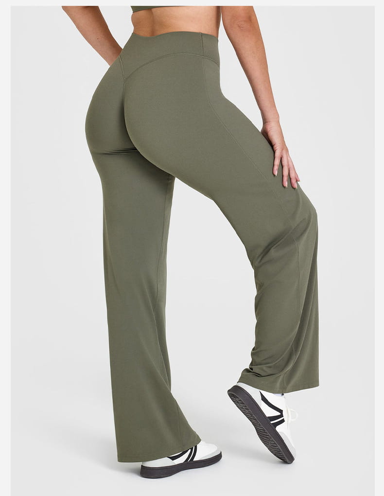 Olive green high-waisted slimming yoga pants with straight leg design made from smooth stretchy fabric.