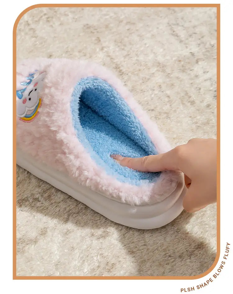 Smiling Cloud and Rainbow Plush cotton slippers featuring pink fluffy exterior with blue interior and a cute unicorn patch on the side.