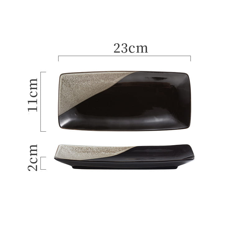 Black ceramic Japanese sushi plate rectangular tray with a textured speckled gray diagonal accent.