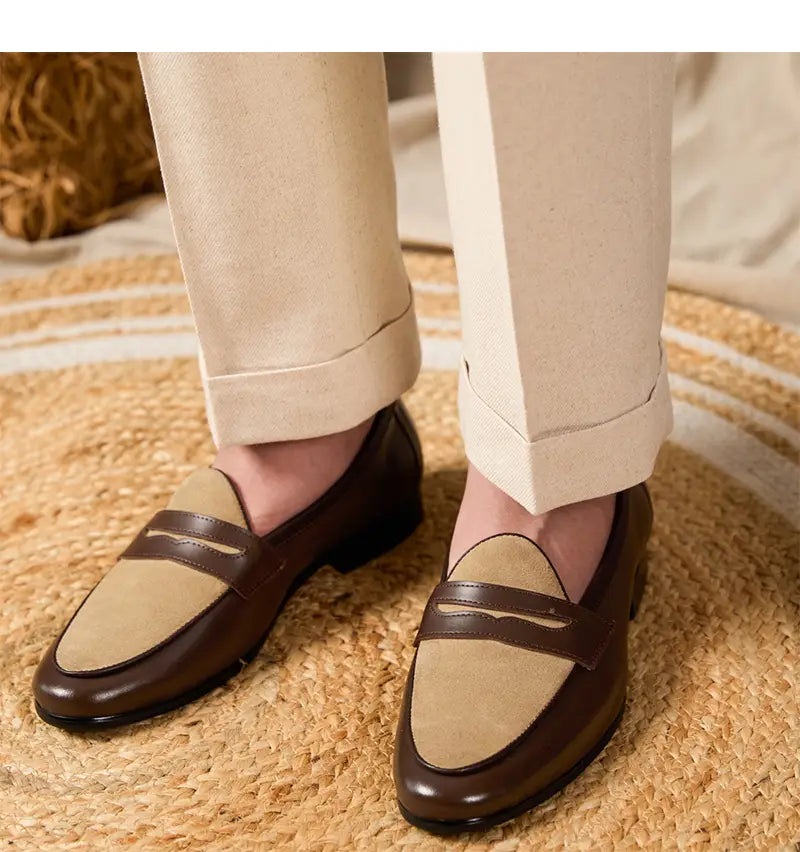 brown and beige two tone leather loafers with a classic slip on design and block heel in british style