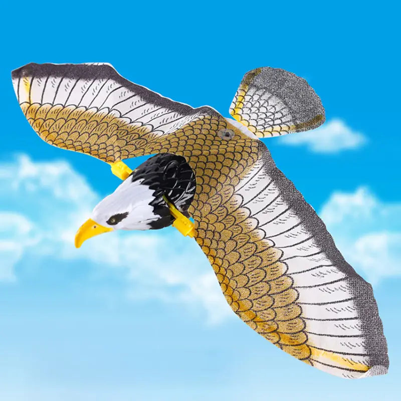 Interactive flying bird cat toy featuring a detailed plastic eagle kite with a white head, black neck, yellow beak and talons, and gold-and-white feathered wings with intricate scale patterns.