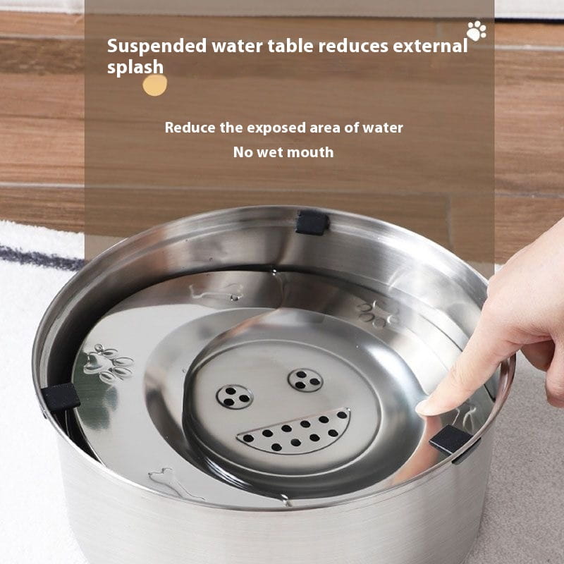 Large stainless steel pet water bowl featuring a suspended design with a smiling face and perforated drinking area for pets.