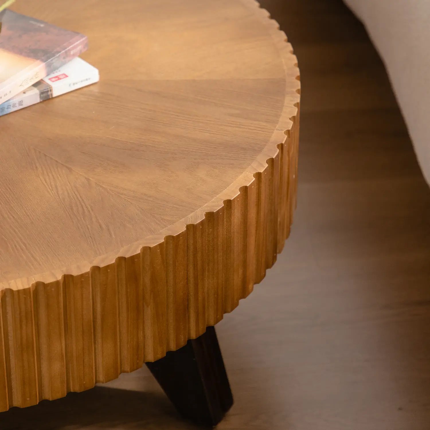 A 35.4 round retro coffee table with a warm natural wooden finish and distinctive vertical fluted wood edges.