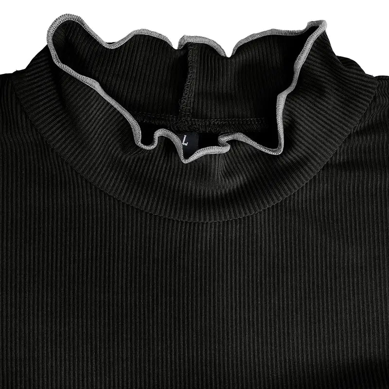 Black ribbed knit slim fit top for women with a ruffled collar trimmed in gray and a mock neck design.
