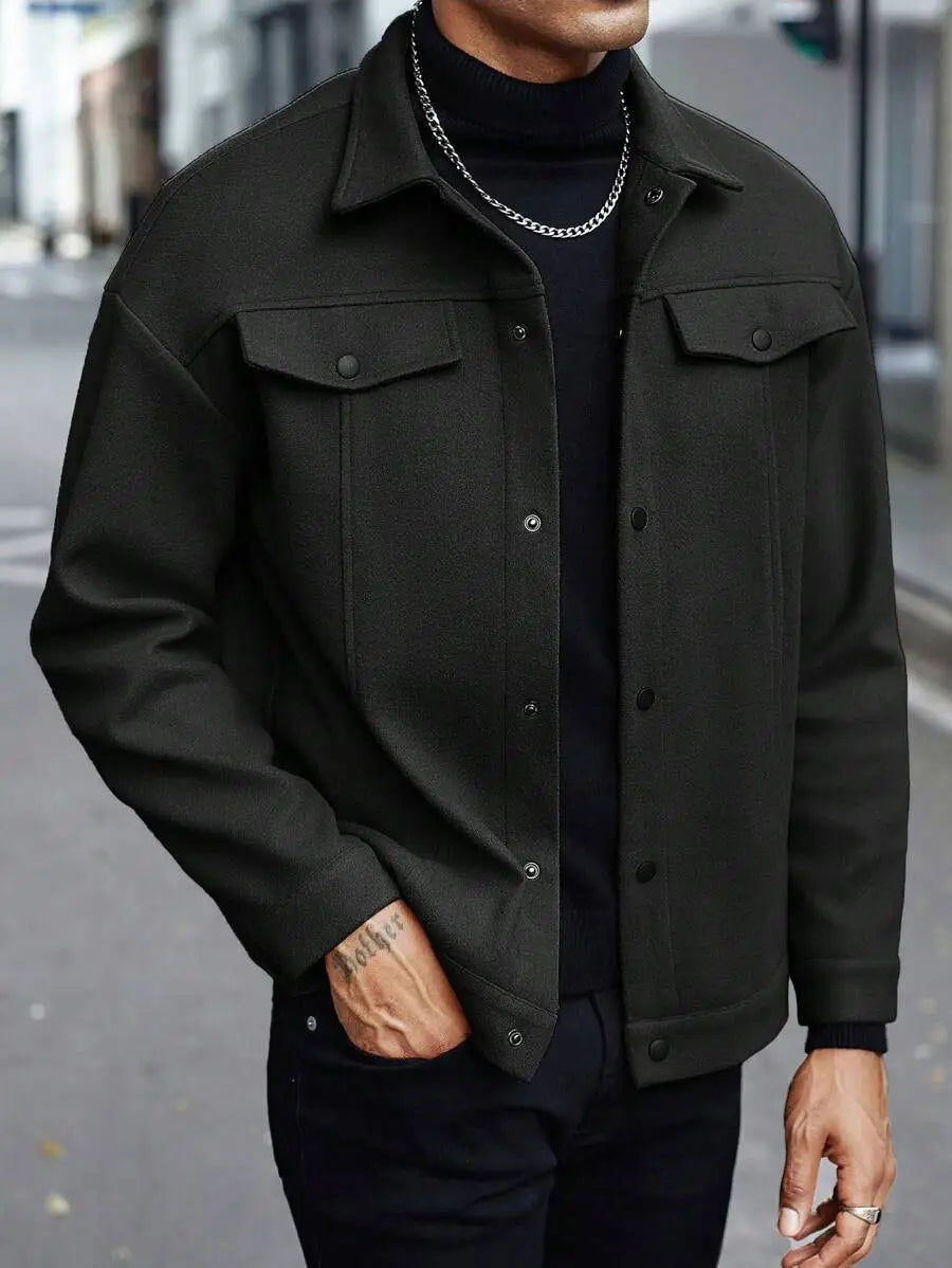 Men’s classic slim fit wool blend lapel jacket in black denim with buttoned flap pockets and a classic collar.