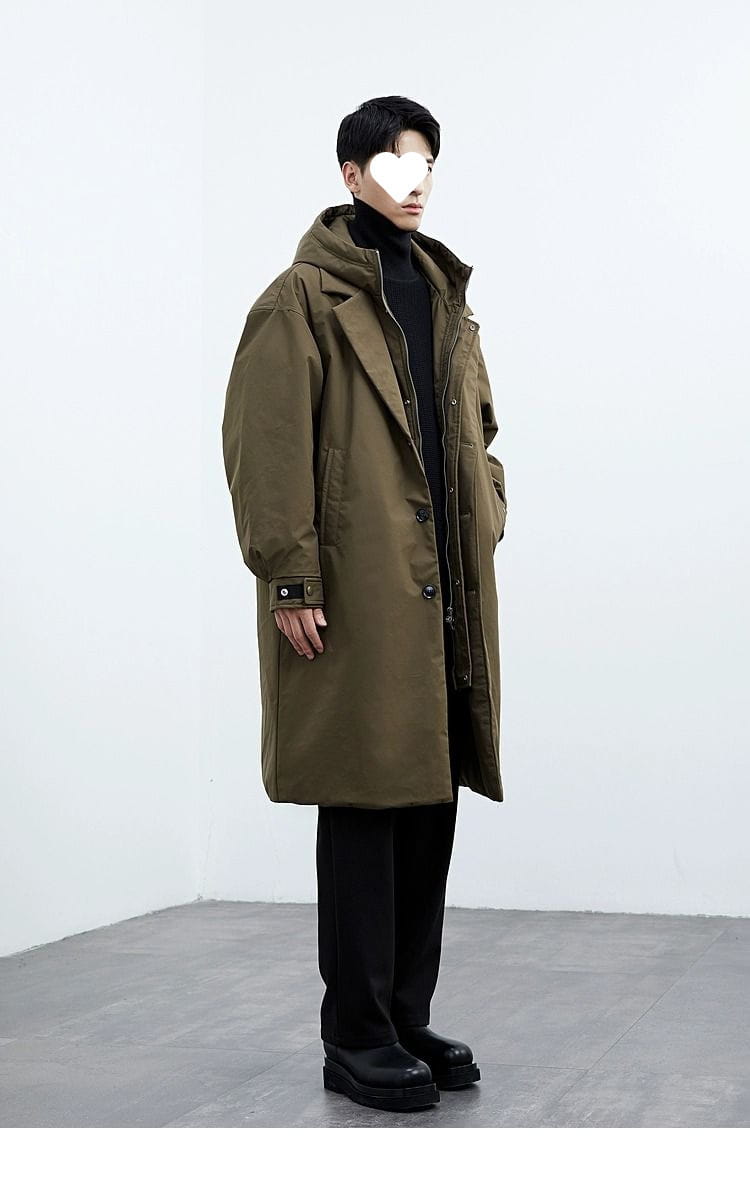 Men hooded trench coat in olive green with black trim and button closures designed as a false two piece winter jacket.