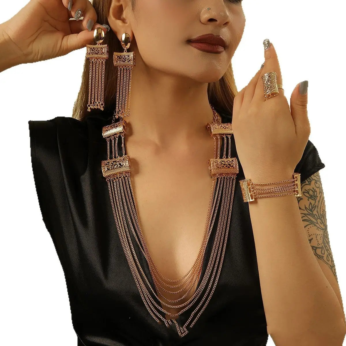 gold layered tassel necklace jewelry set featuring a gold-toned layered necklace with intricate rectangular embellishments and dangling chains