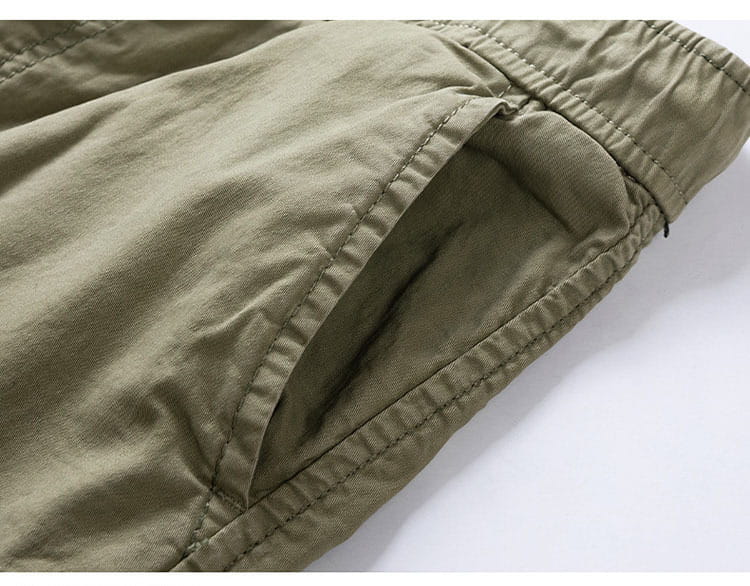 men’s khaki cotton cargo shorts with a relaxed fit drawstring design and visible stitching details