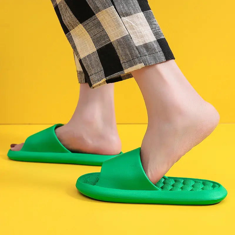 Bright green massage slippers honeycomb textured rubber slides with slip-on design open toe and textured footbed.