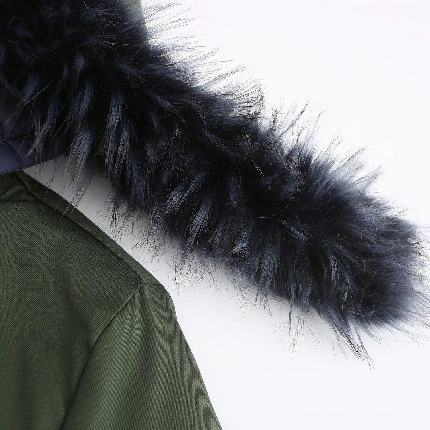 black faux fur trim on the hood of an olive green reversible fur collar quilted parka displayed from the back side