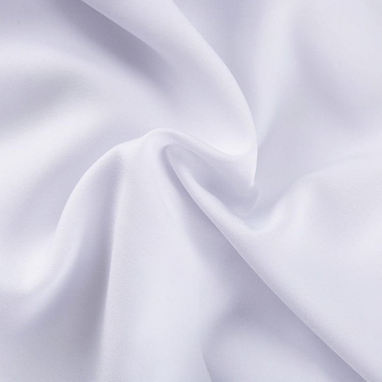 white high waisted balloon jogger pants made of smooth white fabric with a subtle sheen and gentle folds