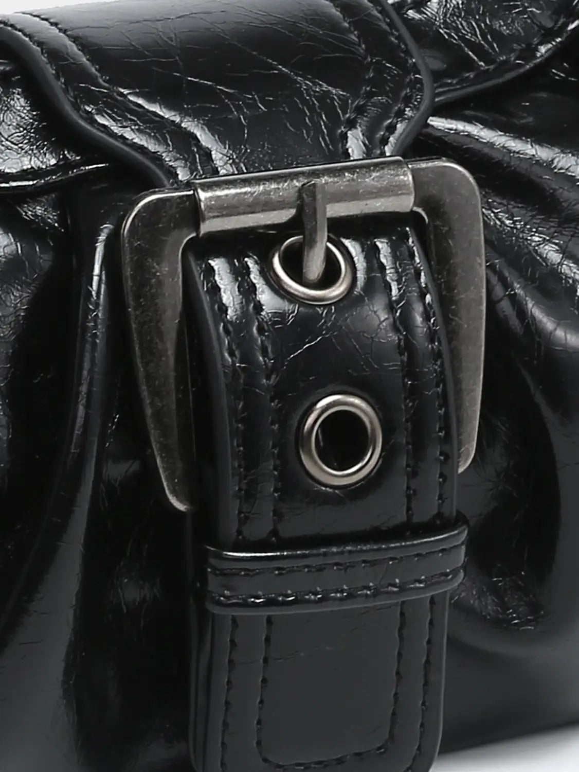 Black patent leather vintage shoulder bag featuring a silver-toned metal buckle and reinforced stitching.