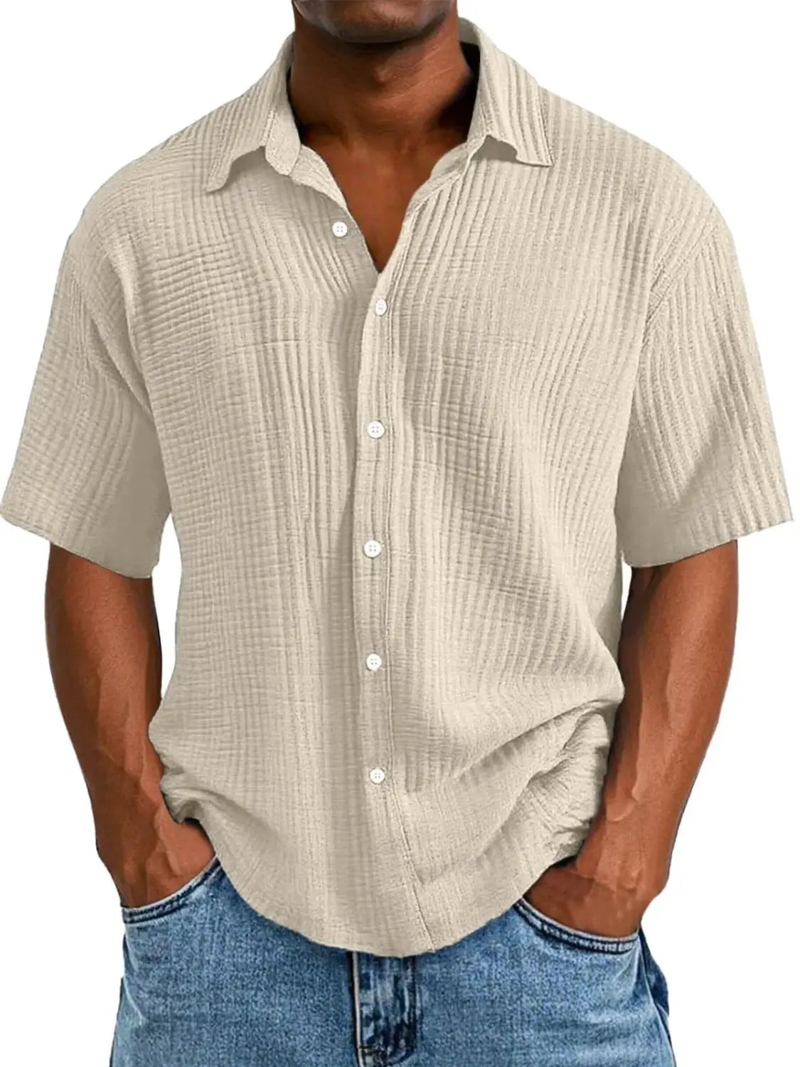 Beige men’s textured short sleeve button up shirt made of ribbed fabric with white buttons.