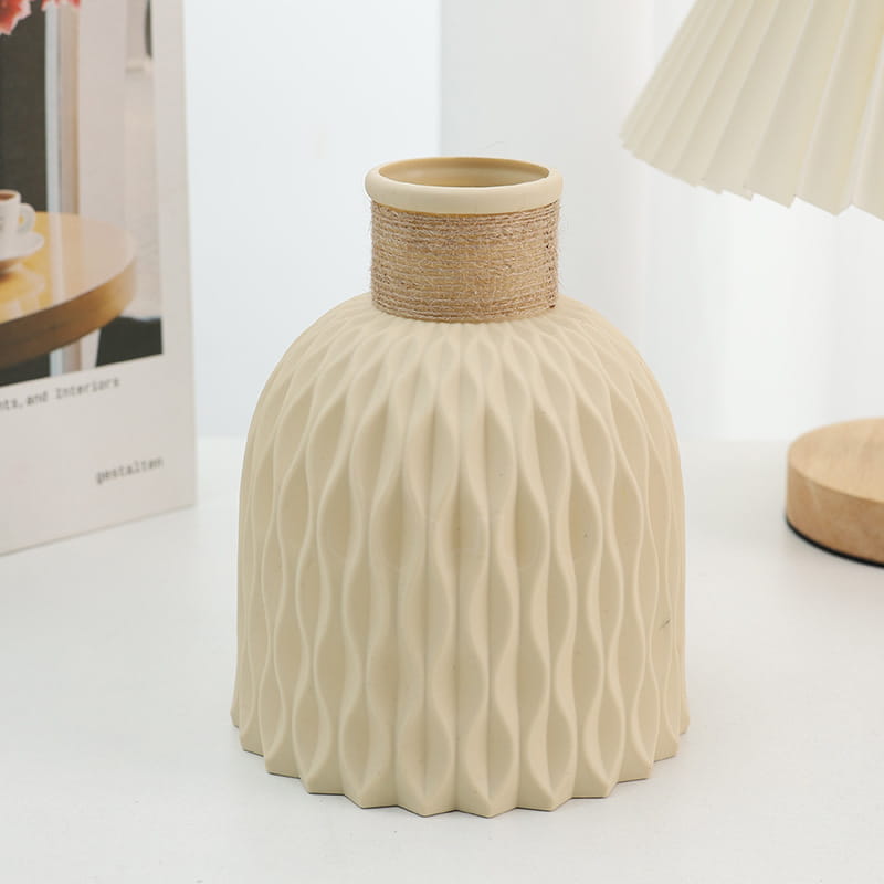 Beige ceramic vase with a textured wavy pattern and natural twine wrapped neck from a ceramic vase set with twine and wavy texture 4 pack.