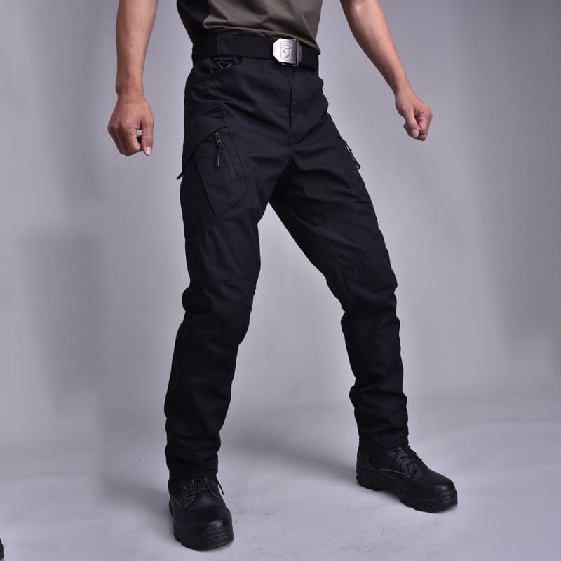 Black tactical military combat pants for men featuring multiple zippered pockets and a sturdy belt loop design.