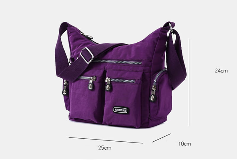 Purple nylon waterproof multi pocket crossbody shoulder bag with multiple zippered compartments and silver toned hardware.