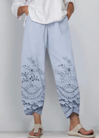 Light blue embroidered cotton wide-leg pants with a relaxed fit and lace-like pattern along the lower legs from the artistic printed and embroidered slimming cropped pants collection.