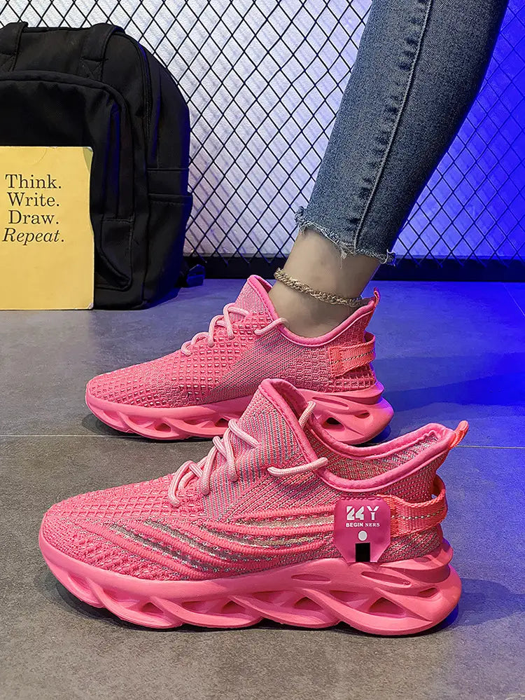 Bright pink flyknit mesh platform running shoes for men featuring a chunky sculpted sole and white laces.