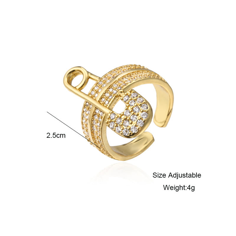 Adjustable gold safety pin zircon geometric ring featuring a gold-toned band designed as a safety pin adorned with clear sparkling crystals.