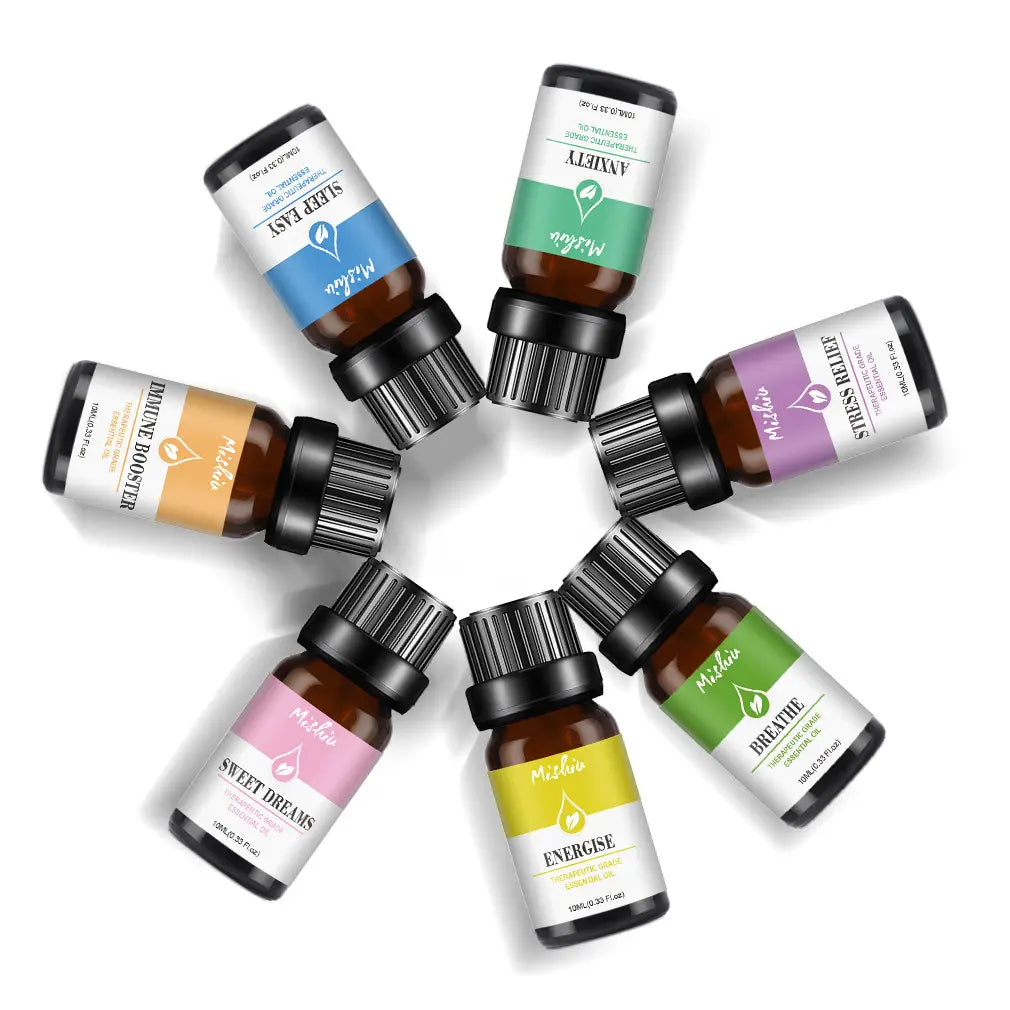 Six amber glass therapeutic grade pure aromatherapy essential oil bottles with black ribbed caps and colorful labels arranged in a circle.