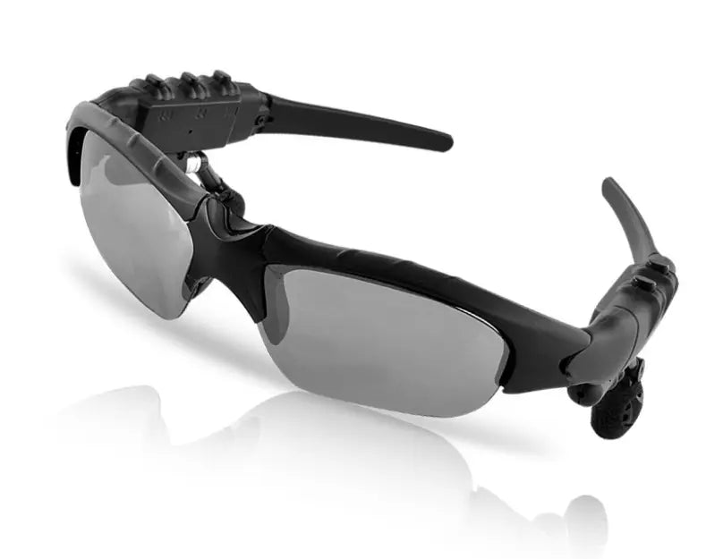 Black sport-style smart bluetooth audio sunglasses with gray tinted lenses and integrated wireless earpiece technology featuring an HD camera and microphone.