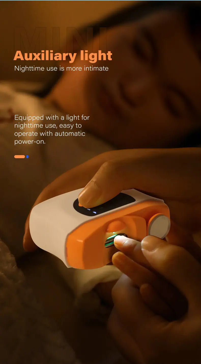 Electric nail clippers with led display and trimmer featuring an orange and white auxiliary light with a sleek ergonomic design for nighttime use.