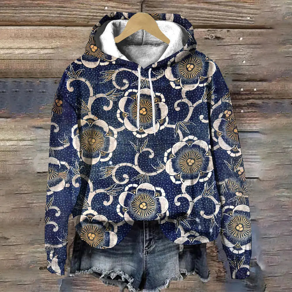 Sudadera con capucha de ajuste holgado con estampado floral azul marino con un patrón blanco y dorado, forro interior gris suave y cordones a juego.