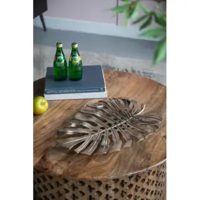 bronze monstera leaf-shaped serving tray made of metal featured in gold monstera leaf wall decor and serving tray collection designed for elegant serving and decoration