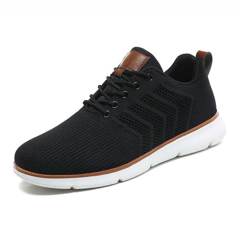 Black knit mesh sneaker for men with brown leather accents and a white rubber sole designed for casual flying woven comfort.