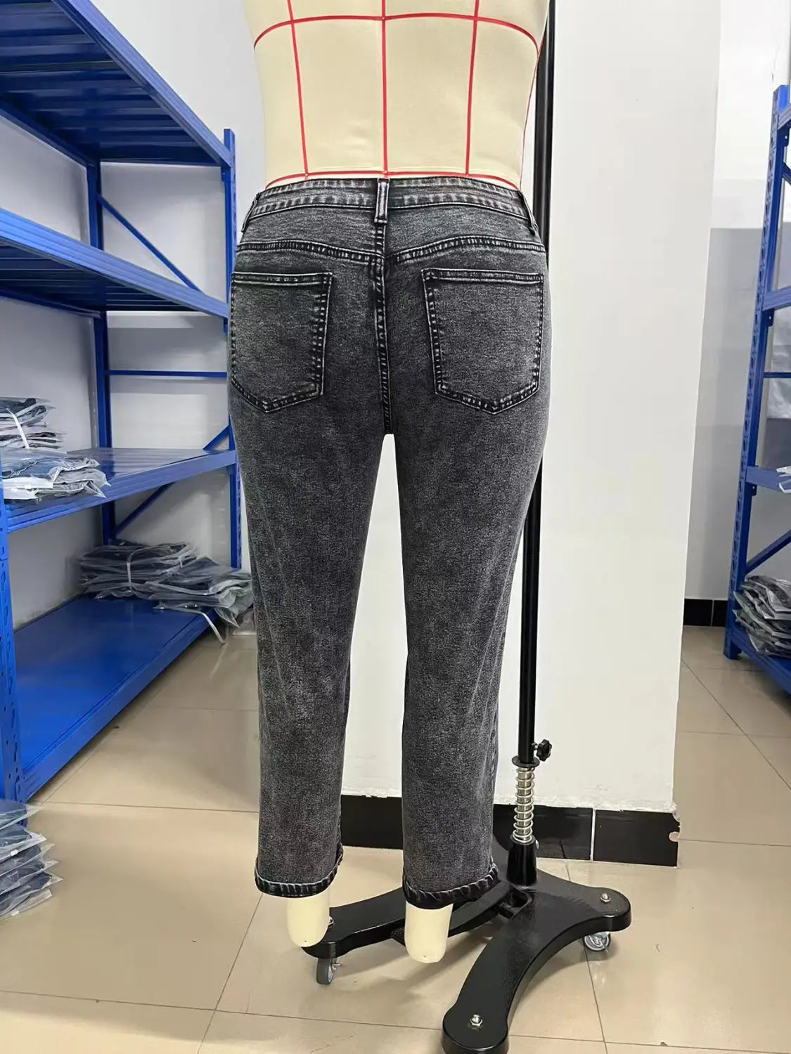 plus size retro washed tapered denim jeans in dark gray faded denim shown from the back with straight-leg cut and classic back pockets.