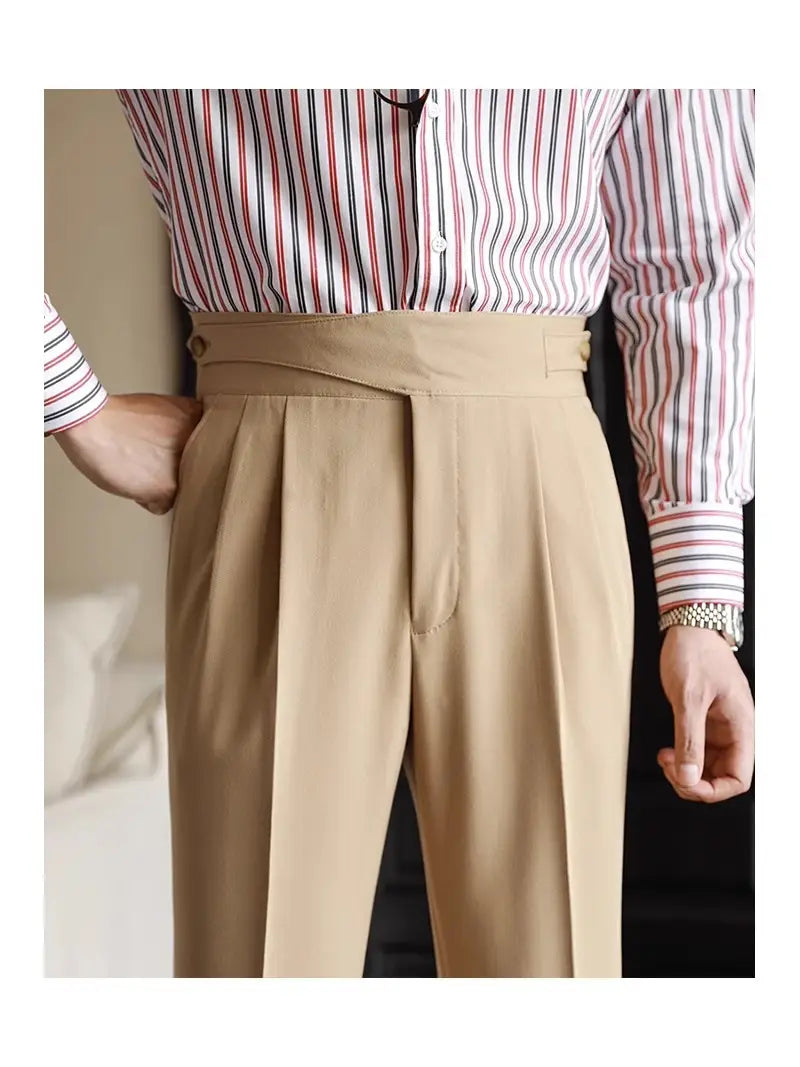 Beige tailored pleated wool men’s trousers with straight leg design, waistband, and gold-toned belt loops.